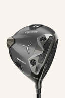 TaylorMade Qi35 LS Driver, Golfschläger mit glänzendem Schlägerkopf und schwarzem Griff, auf einem Golfplatz liegend