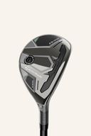 Hybrid TaylorMade Qi35 Max Rescue, gold und schwarzes Design, mit Schlägerkopf und Griff sichtbar.