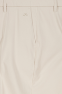 Lange Golfhose von J. Lindeberg, schwarze Damenhose mit schmalem Schnitt und sportlichem Design, auf weißem Hintergrund.
