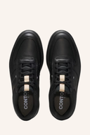 Footjoy Contour Casual Golfschuhe in Schwarz mit bequemer Sohlentechnologie, für stilvolles Golfspiel.