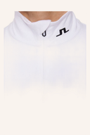 J. Lindeberg Tour Tech Midlayer, bequemer Midlayer mit atmungsaktivem Material, in neutraler Farbe, für sportliche Aktivitäten.