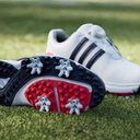 Adidas Tour360 Boa 2024 Golfschuhe mit schwarzem Obermaterial und grünem Akzent, seitliche Ansicht, sportliche Passform