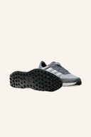 Adidas S2G Spikeless BOA 24 Golfschuhe, schwarz, mit BOA-Drehverschluss, sportliches Design, auf glattem Golfplatz.