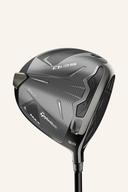 TaylorMade QI 35 Max Driver mit schwarzem Schlägerkopf und grünem Griff, bereit für den Abschlag.