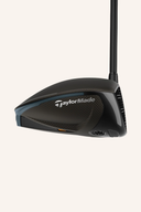TaylorMade Qi4D Driver mit schwarzem Schlägerkopf und grünem Griff, Nahaufnahme des Golfdrivers.