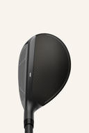 Hybrid TaylorMade Qi4D Max Rescue mit schwarzem Schaft und Taylormade-Branding, bereit für den Einsatz auf dem Golfplatz.